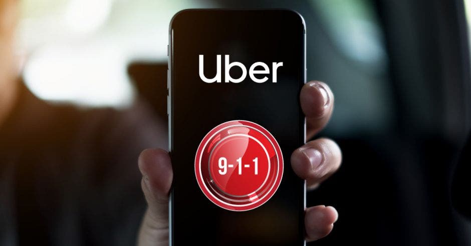 Celular con el logo de Uber y un botón de emergencia en la pantalla