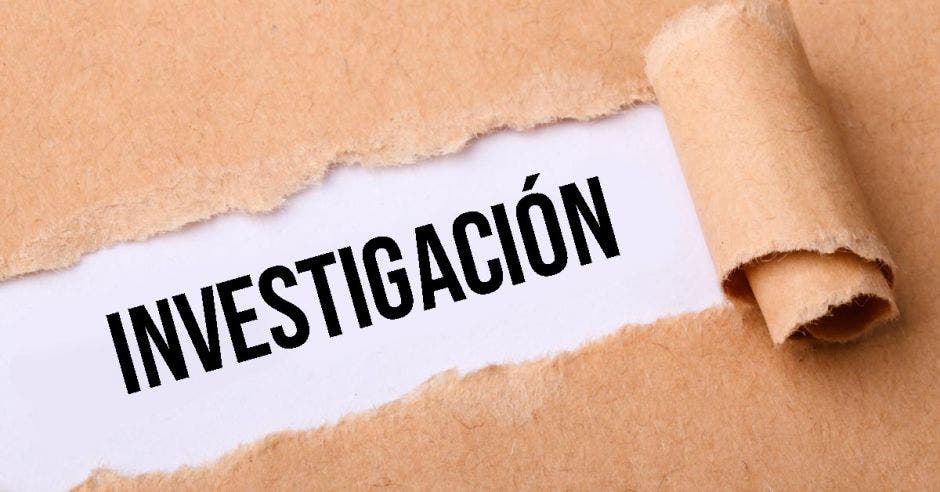 Un papel y la palabra investigación