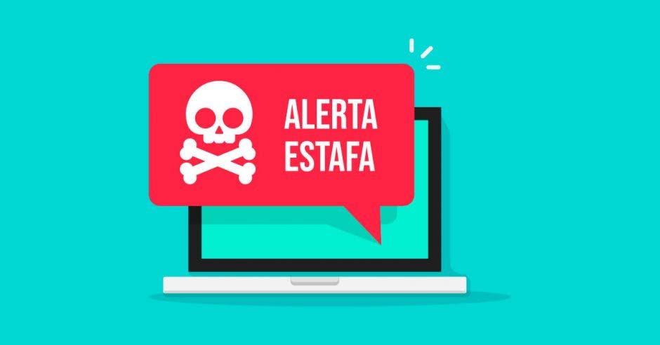 computadora con fondo verde en donde sale la alerta de estafa con signo de calavera