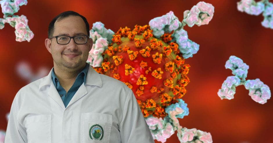 German Madrigal, director del Instituto de Investigaciones Farmacéuticas-UCR y un fondo de un coronavirus atacado por anticuerpos