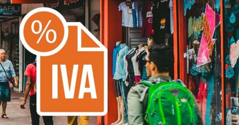 anuncio de IVA color naranja sobre imagen de comercios