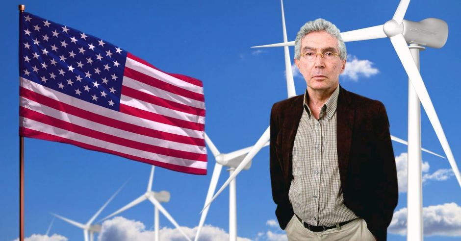 un hombre de edad avanzada sobre un fondo de molinos de viento y una bandera de los Estados Unidos